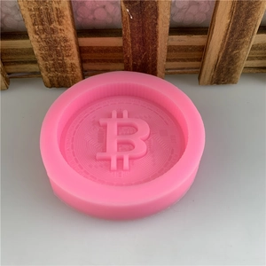 Pink round silicone mold featuring Bitcoin currency symbol for DIY chocolate and soap
