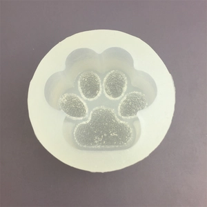 Macro top view of semi-transparent cat paw silicone mold for DIY baking and resin crafts