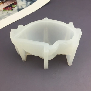 Seal-shaped silicone mold for DIY candles and soaps on a deep purple surface