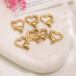 Set di sette fermagli a molla a forma di cuore in acciaio inossidabile dorato per gioielli