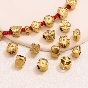 Set perline distanziatrici in acciaio placcato oro 18K con forme corona fiore stella