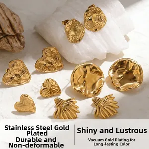 Macro detail of gold plated stainless steel earrings with textured hammer finish