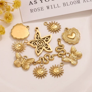 Polished gold DIY charms set including sun heart and butterfly shapes for jewelry making