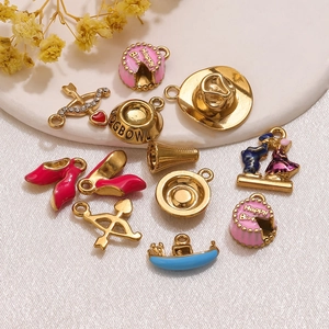 DIY jewelry pendants set featuring enamel charms like cake and hat for necklace making