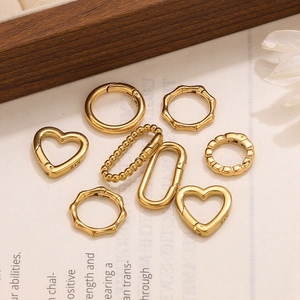 Set of 8 gold heart and geometric shaped spring clasps for DIY jewelry making