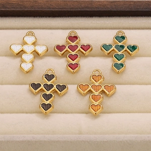 Cross pendant set featuring six heart-shaped colorful enamel motifs in gold finish