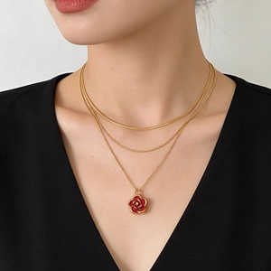 Elegant triple-layered 18K gold chain necklace with a red enamel camellia rose pendant