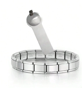 Macro view of stainless steel modular link bracelet with adjustment opening tool