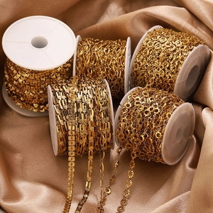 Detailed macro of various 18K gold plated DIY jewelry chains on white plastic spools