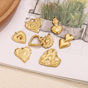 Collection of various golden heart pendants with textured patterns for DIY jewelry making