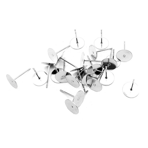 Close-up of flat tray earring posts in silver finish for DIY jewelry making