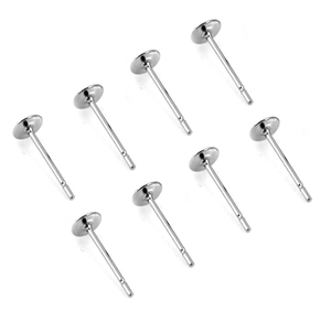 Eight silver flat pad earring posts in stainless steel arranged on a white background