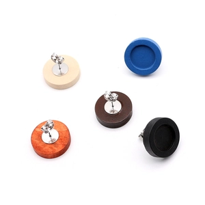 Detailed macro view of 12mm round wood stud earring bases in five different colors