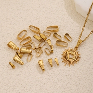Golden stainless steel pinch bails with textured patterns and heart pendant on stone base