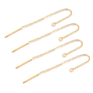 Detail of four golden stainless steel ear threaders with fine O-chains for DIY jewelry