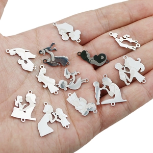 Family silhouette stainless steel charms for DIY bracelets and necklaces shown in hand