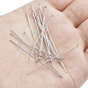 304 stainless steel T-pins for jewelry making shown in hand for scale reference