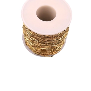 Roll of polished gold stainless steel tube and O-link chain for DIY jewelry making