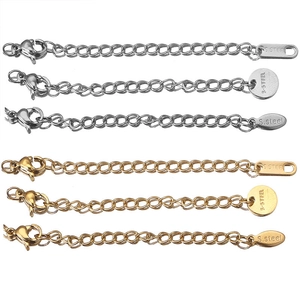 Detail showing 5cm stainless steel extender chains in silver and gold with lobster clasps
