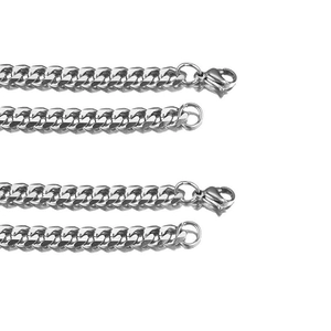 Set of four silver stainless steel Cuban link chains with lobster clasps on white background