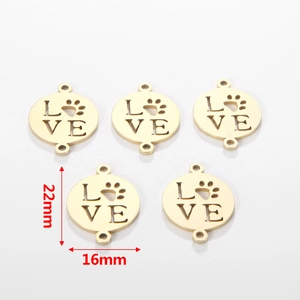 Detail of 22x16mm gold plated stainless steel hollow LOVE charms with paw prints