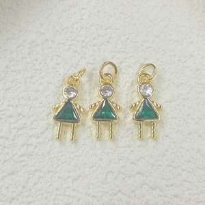 Close-up of three golden triangle zircon girl charms for DIY jewelry making