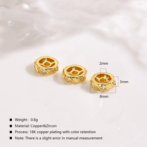 Macro shot of 8mm 18K gold plated copper spacer bead with zircon inlay for jewelry DIY