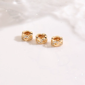 Macro detail of 18K gold plated spacer beads with zircon for DIY jewelry making