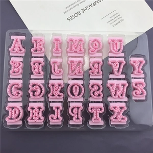 Set of 26 uppercase alphabet cookie cutters in pink plastic for fondant and clay