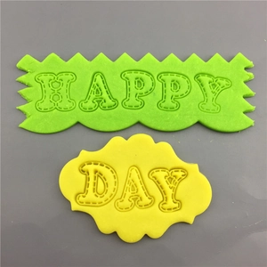 Green and yellow cartoon alphabet cookie molds featuring Happy Day stitched lettering