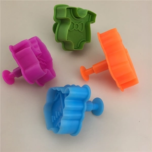 Baby onesie spring-loaded plastic cookie cutters set in four vibrant colors