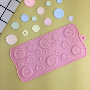 Pink silicone button mold for chocolate and fondant with colorful DIY craft samples