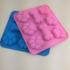 Pink and blue silicone paw and bone baking molds for cake, jelly, and chocolate making