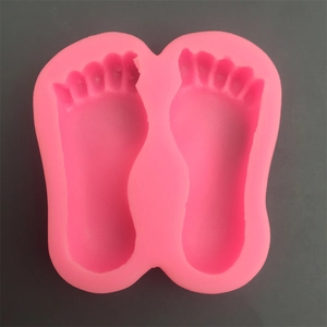 Pink silicone baby feet mold for DIY fondant, chocolate, and cake decorating crafts