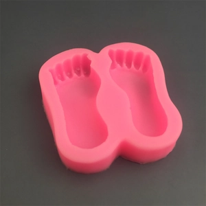 Pink silicone baby feet footprint mold for DIY chocolate fondant and soap crafting