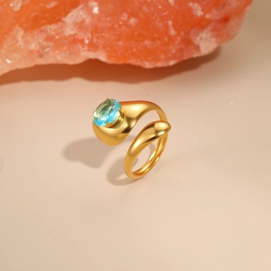 Detailed view of the 18K gold plated ring featuring a large oval-cut blue zircon stone