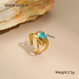 Macro shot of gold plated irregular ring with square blue zircon stone and weight data