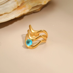Irregular hollow 18K gold-plated stainless steel ring with a round blue zircon gemstone