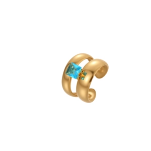 Gold-plated hollow ring with a square blue zircon and star detail on white background