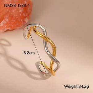 Detail of twisted two-tone stainless steel bangle showing 6.2cm diameter and 34.2g weight