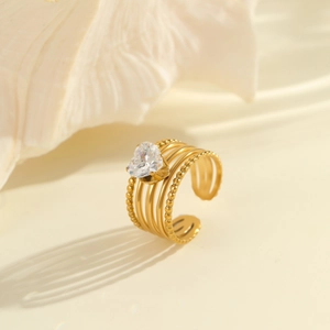Detail of multi-layer 18K gold plated steel ring with a heart-shaped zircon stone