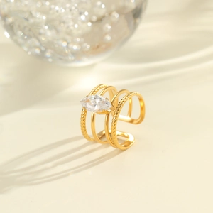 Detail of 18K gold-plated multi-layer ring with marquise-cut zircon and twisted texture