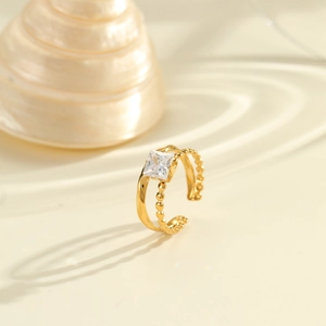 Detail of double-layer 18K gold-plated stainless steel ring with square zircon stone