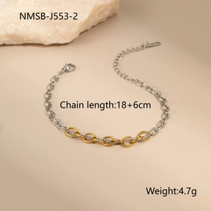 Detailed shot of two-tone 18K gold and silver chain bracelet with size measurements
