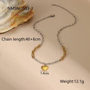 Detail of two-tone gold and silver chain necklace with a heart pendant 40+6cm