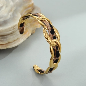 Polished 18K gold plated stainless steel open bangle with leopard print fabric ribbon