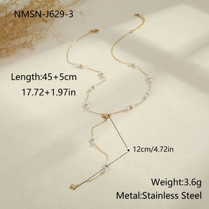 Detail view of gold Y-shaped stainless steel necklace with faux pearls and star pendant