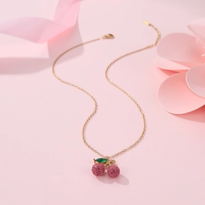 Sparkling pink rhinestone cherry pendant necklace on an 18K gold plated chain