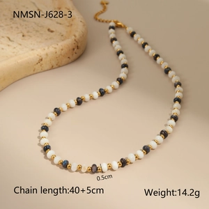 Detail of beaded necklace showing 0.5cm beads and 40+5cm length on a stone tray