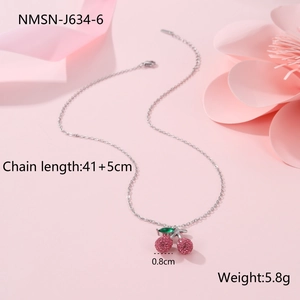 Close-up of diamond cherry pendant necklace in 18K gold with size and weight info